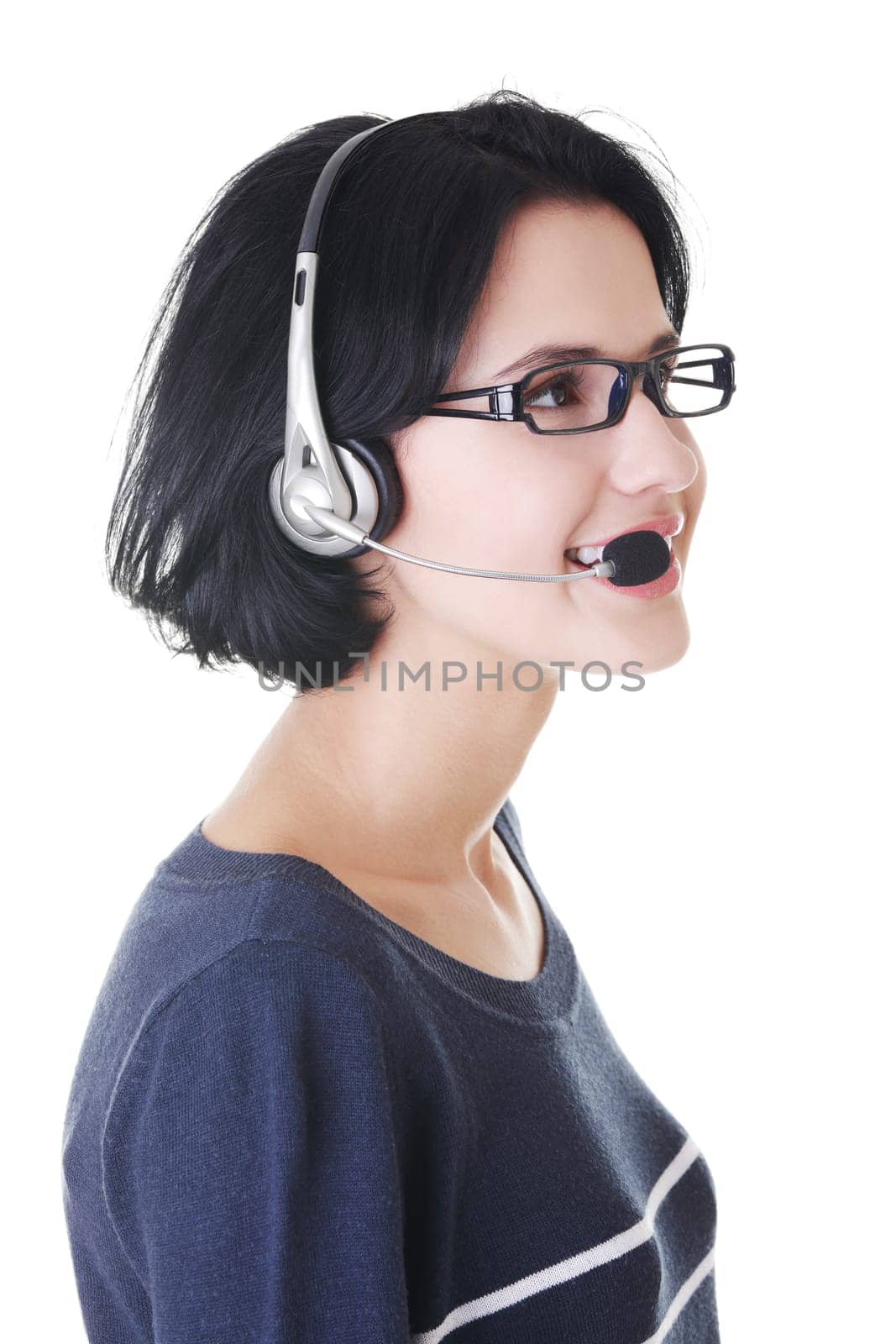 Closeup of attractive customer support representative smiling with headset