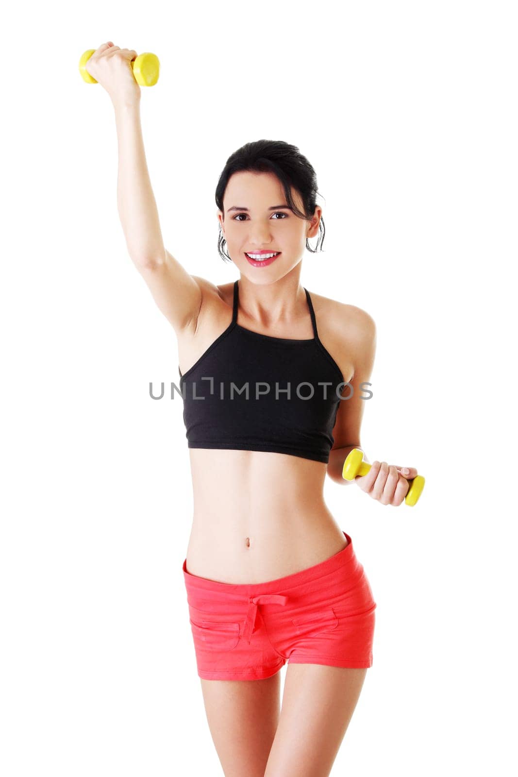 Fitness girl is working out with dumbbells , isolated on white background