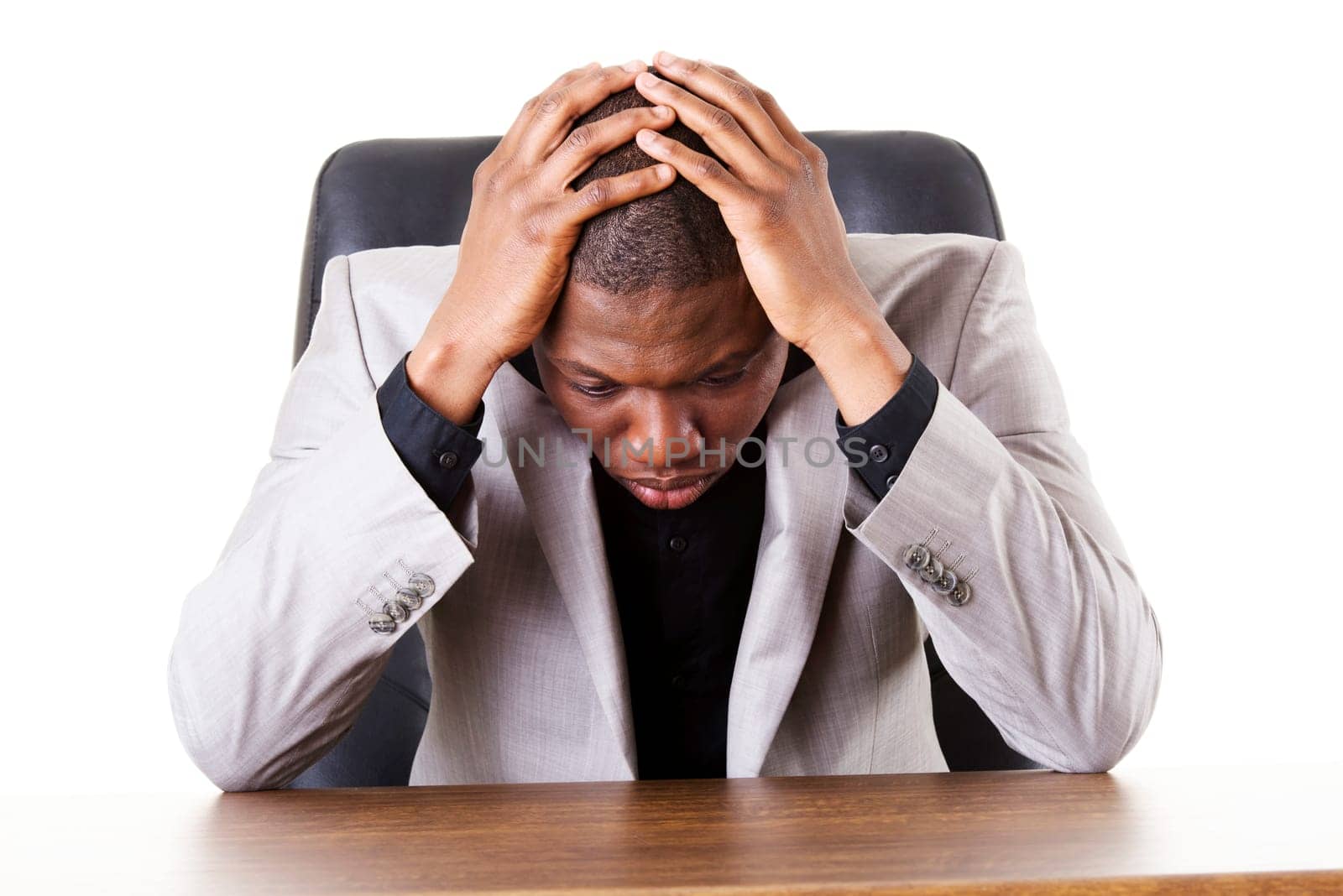 Sad, tired or depressed businessman at the desk.