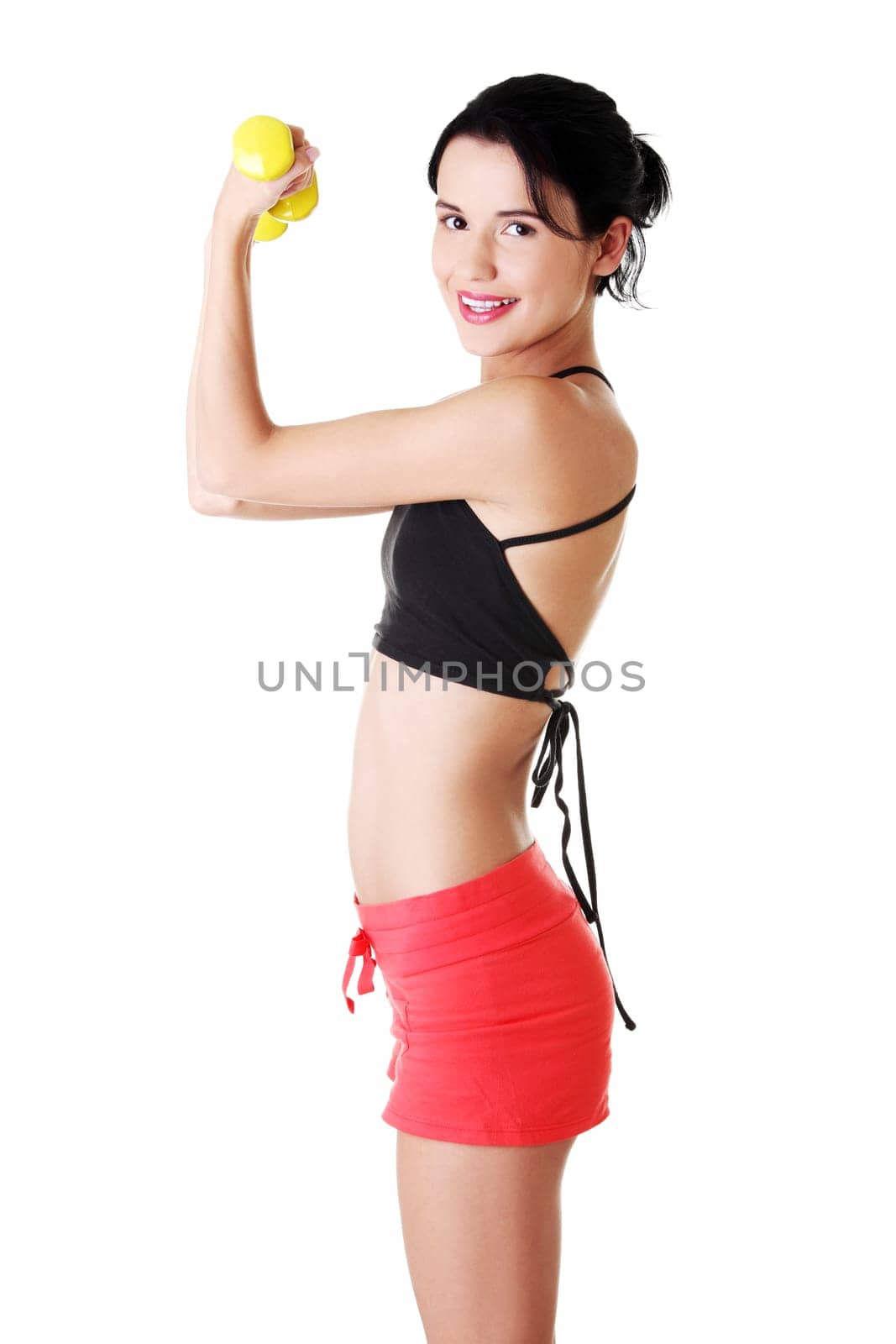 Fitness girl is working out with dumbbells , isolated on white background