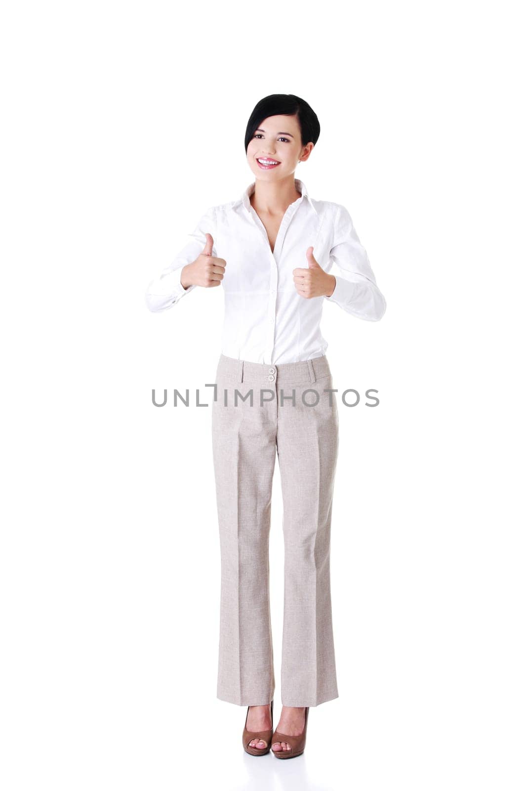 Happy smiling business woman with ok thumbs up gesture