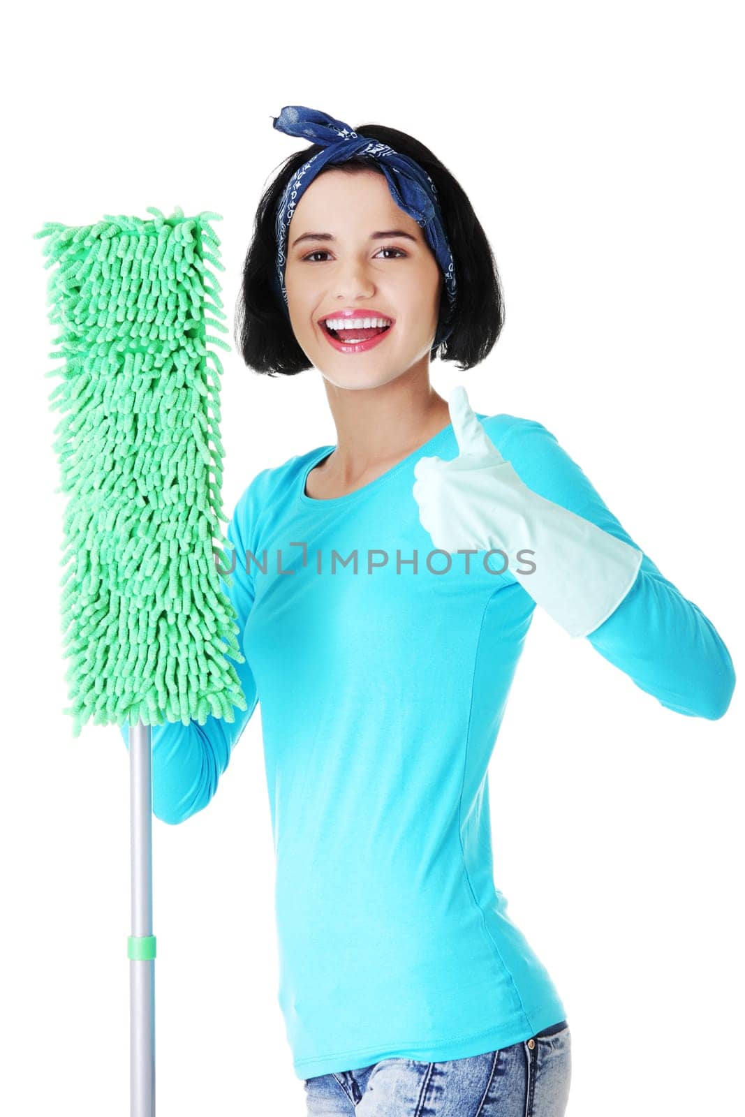 Happy cleaning woman gesturing thumbs up, isolated on white
