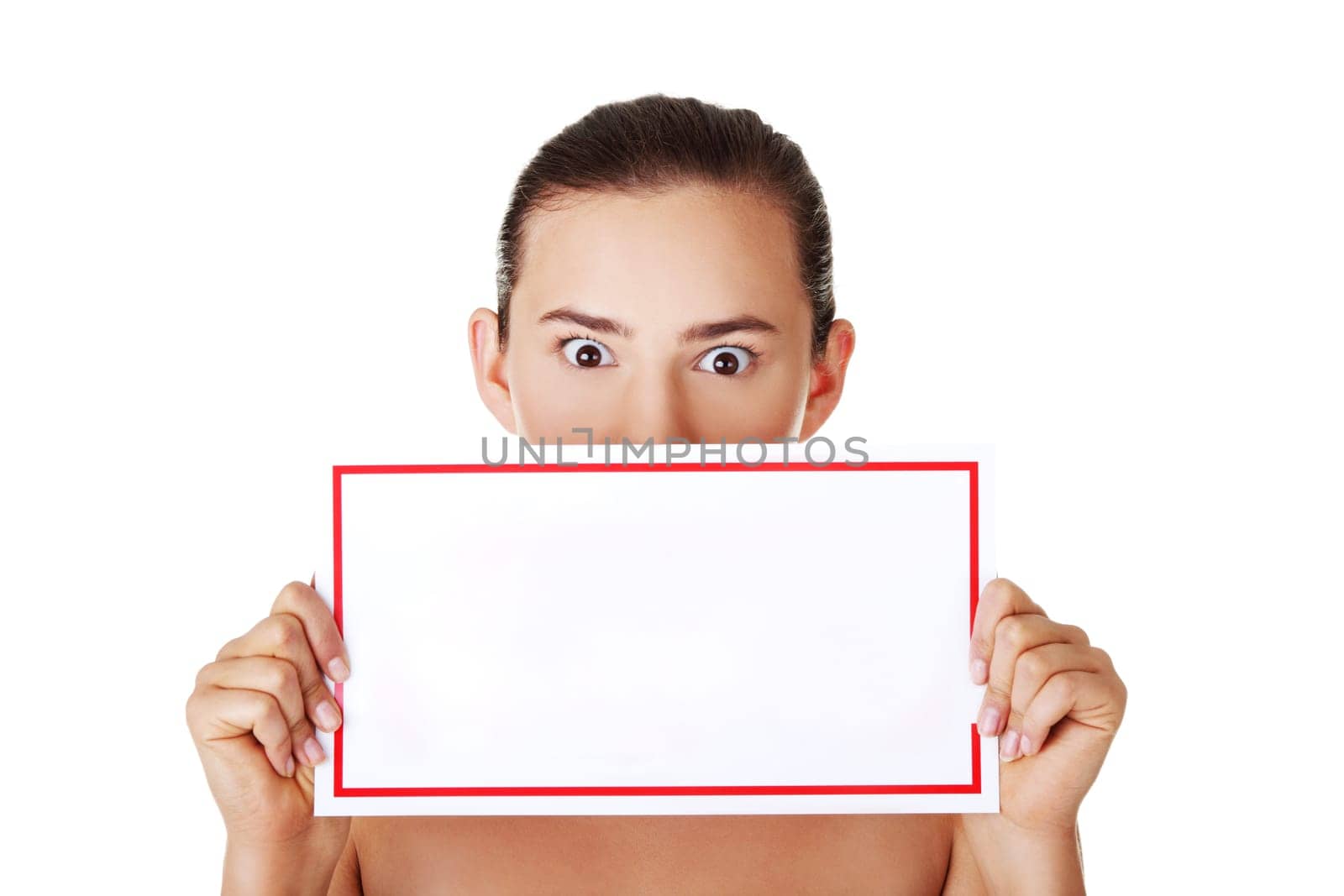 Shocked woman holding blank board, isolated on white