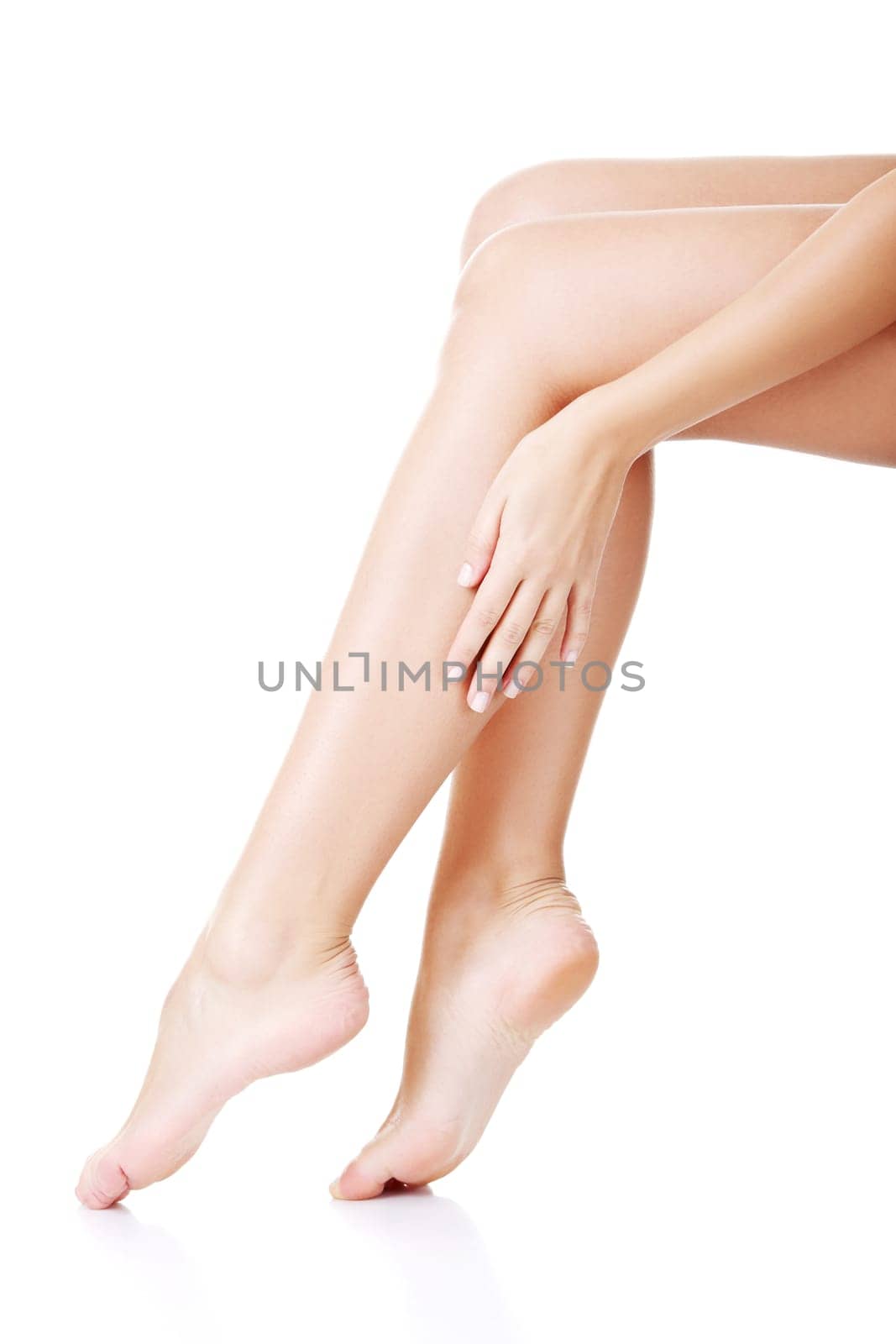 Beautiful fit long female legs, isolated on white