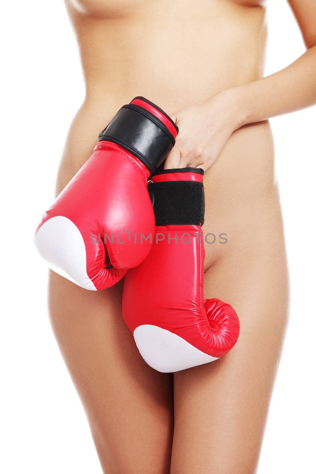 Beautiful fit nude woman body with boxing gloves. Feminism concept. Isolated on white