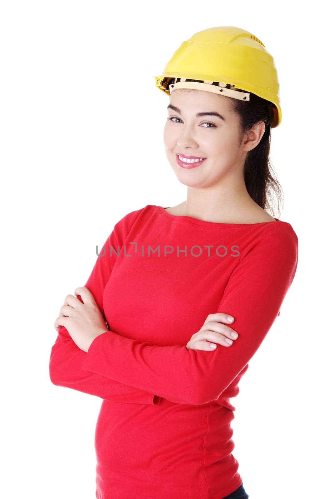 Portrait of confident female worker in helmet. Isolated on white