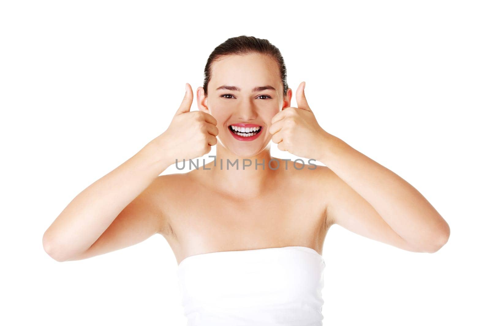 Young student woman gesturing OK , isolated on white.