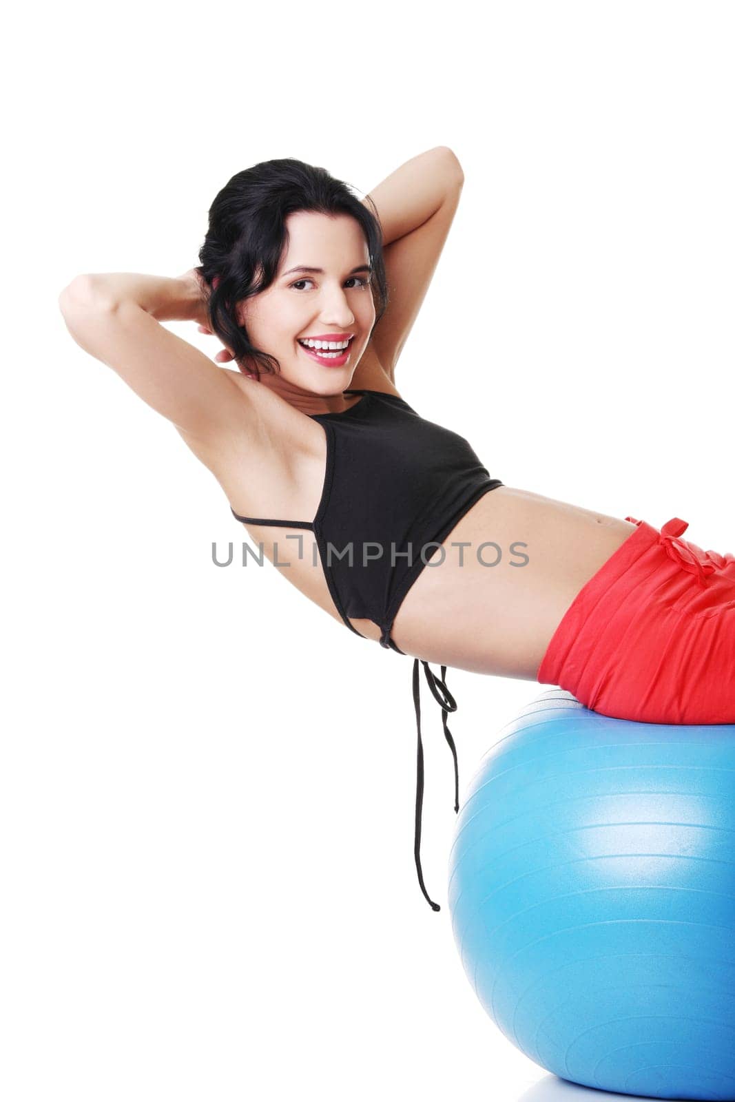 Beautiful young healthy lifestyle woman with pilates exercise ball.