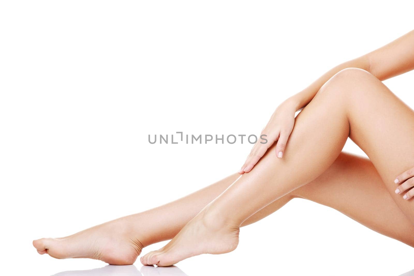 Beautiful fit long female legs, isolated on white