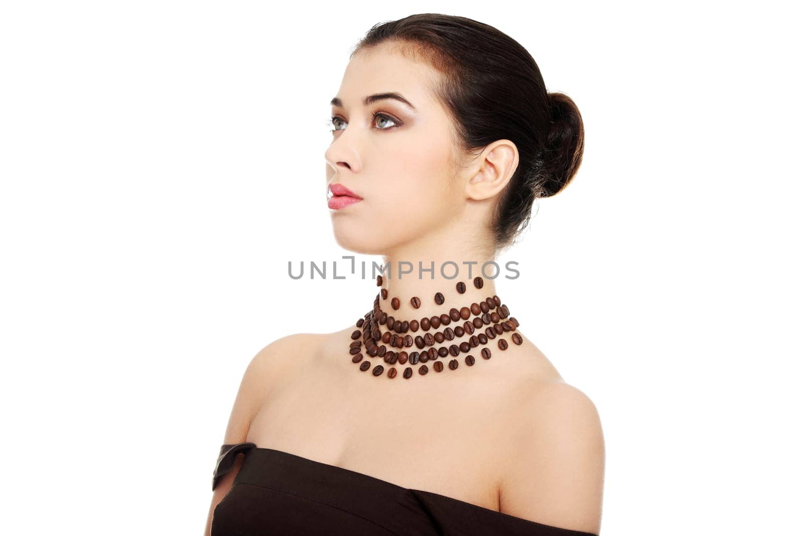 Beautiful elegant young woman with necklace made frome coffee beans, isolated on white