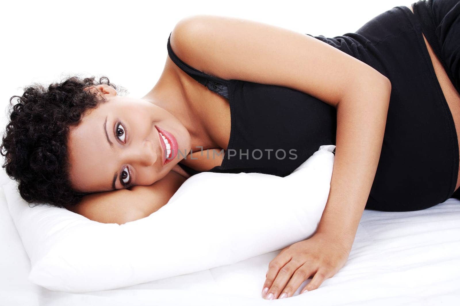 Pregnant woman sleeping on her bed