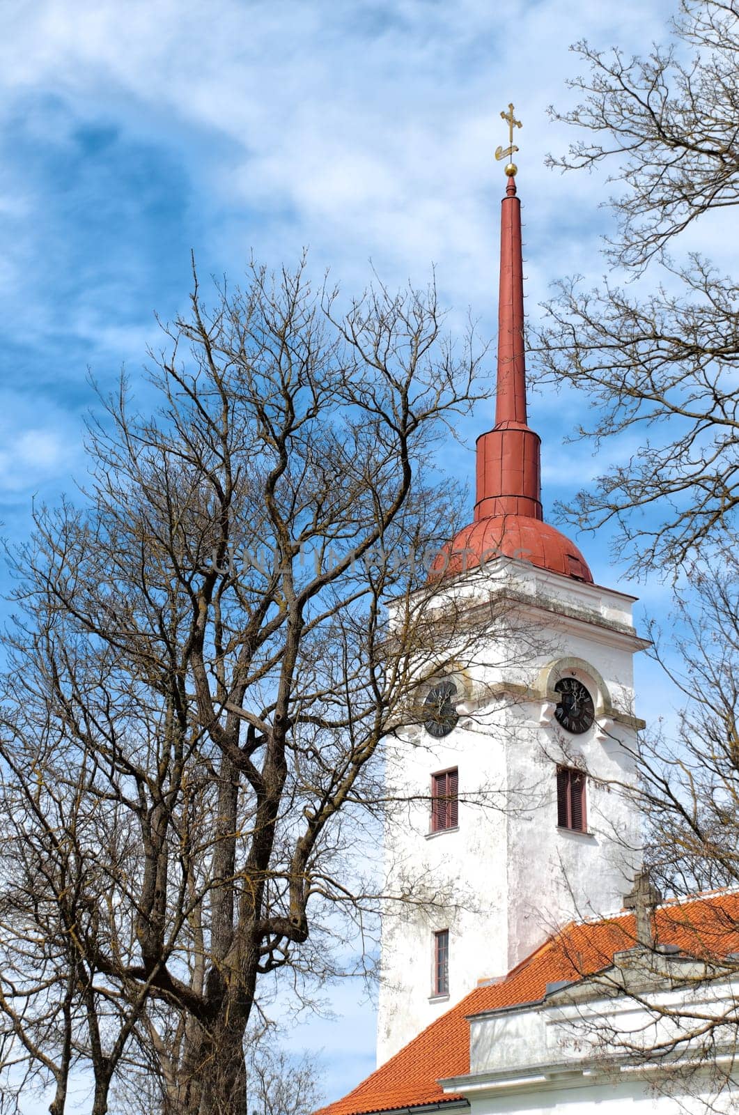 beautiful old church with blue cloudy sky in background (Lawrence's church of Kuressaare, Saaremaa, Estonia)