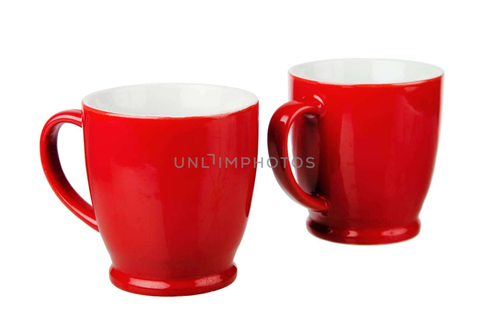 Two red ceramic mug, isolated on white