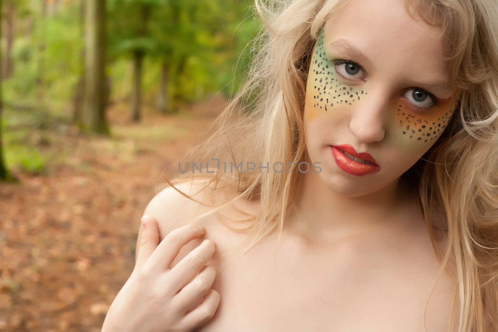 Happy teenager in a forest in the autumn