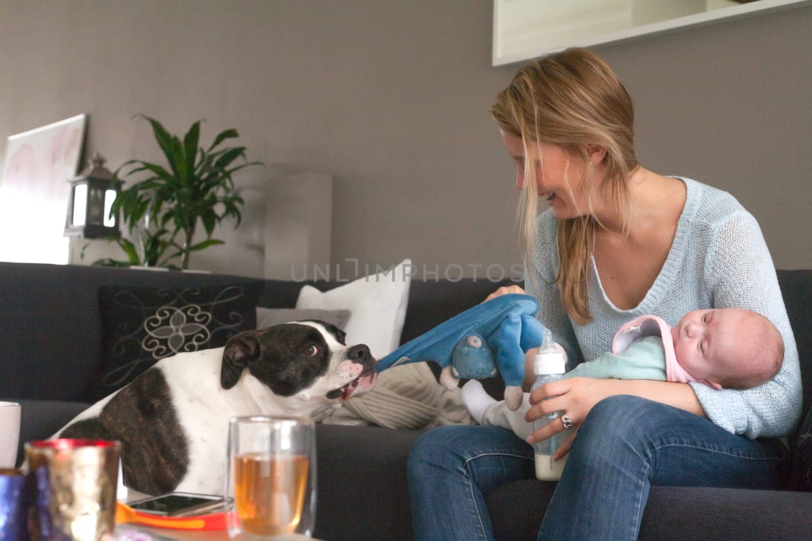 Happy young parents and their little baby
