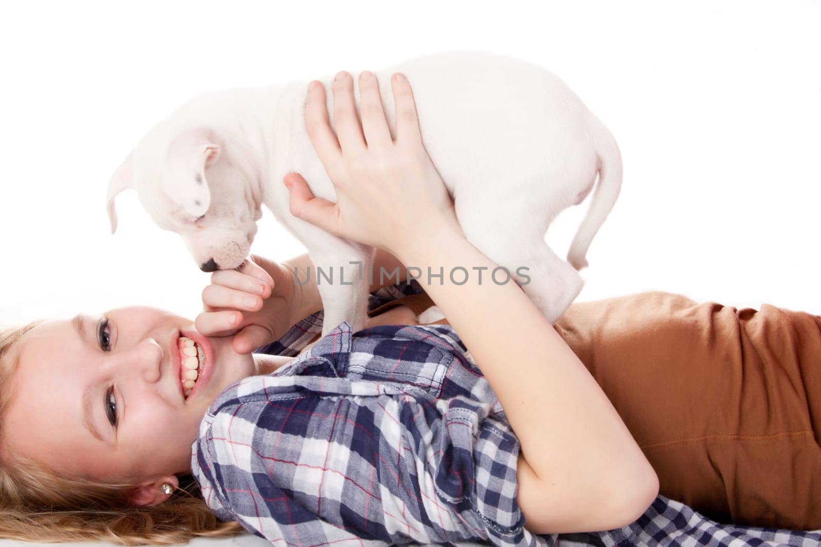 Young girl having a great time with the puppies