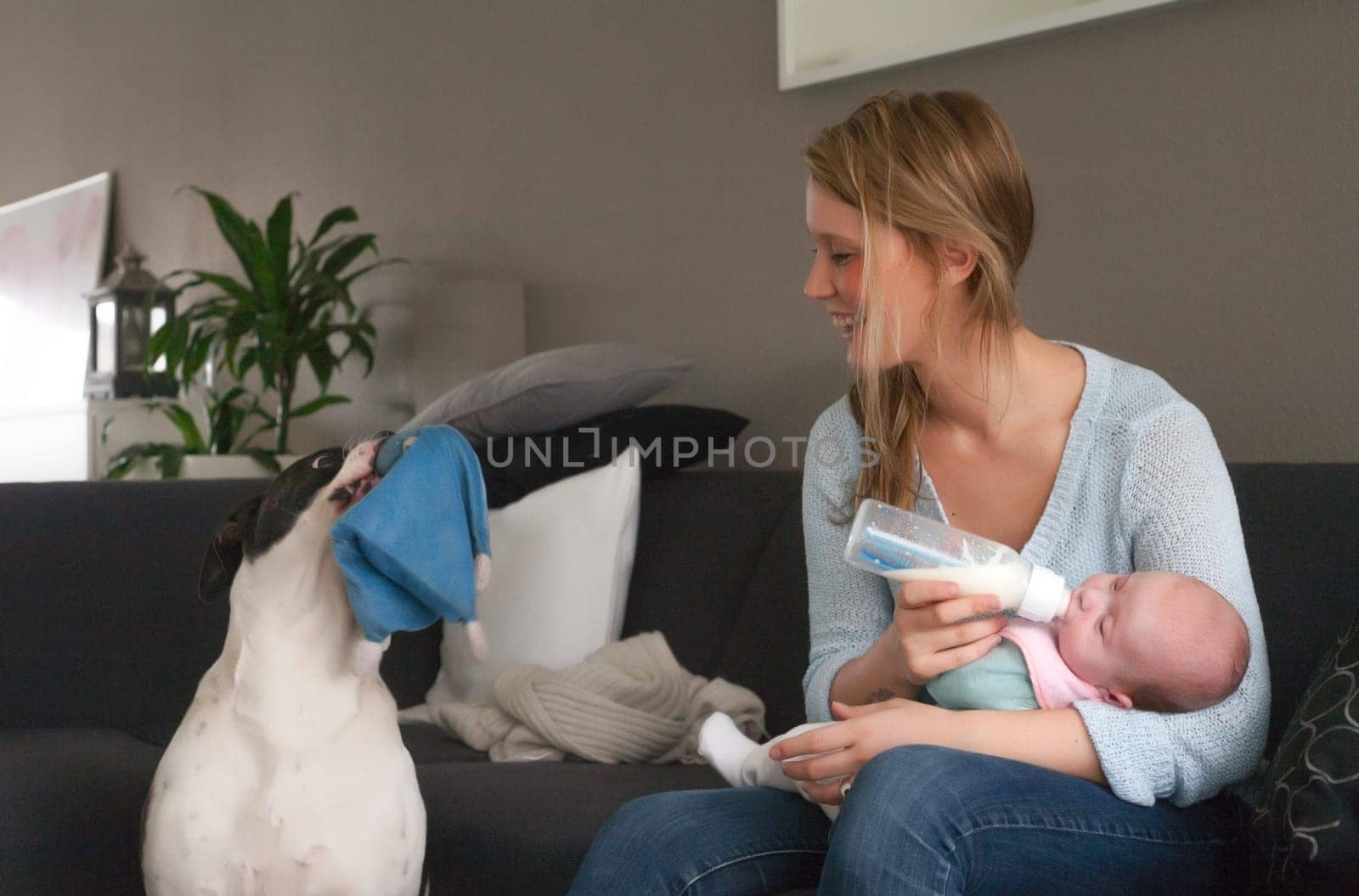 Happy young parents and their little baby