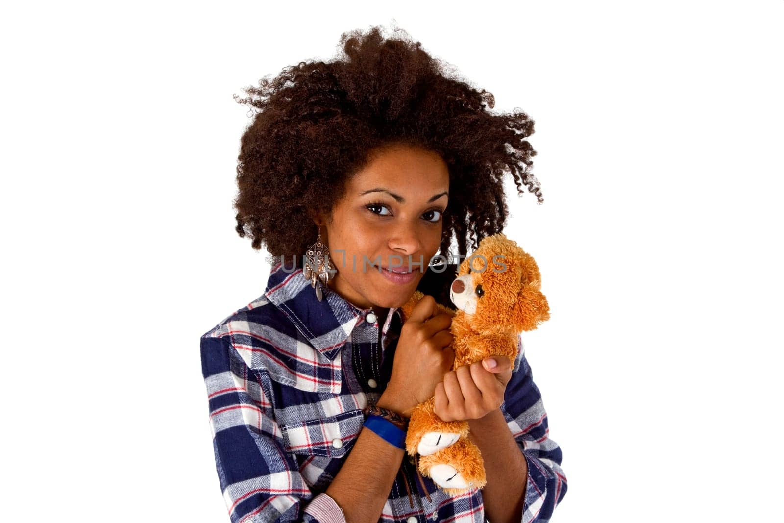 Young woman holding teddy bear in her arms isolated on white background