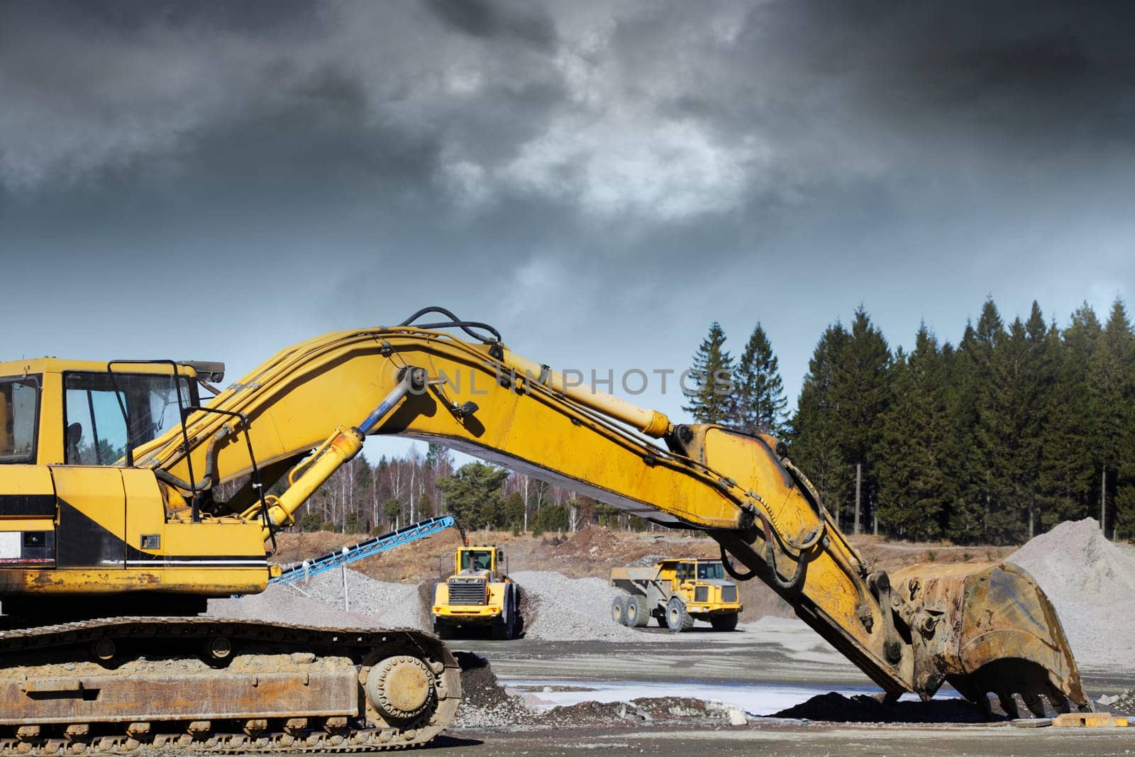 giant bulldozers and diggers in action inside building site
