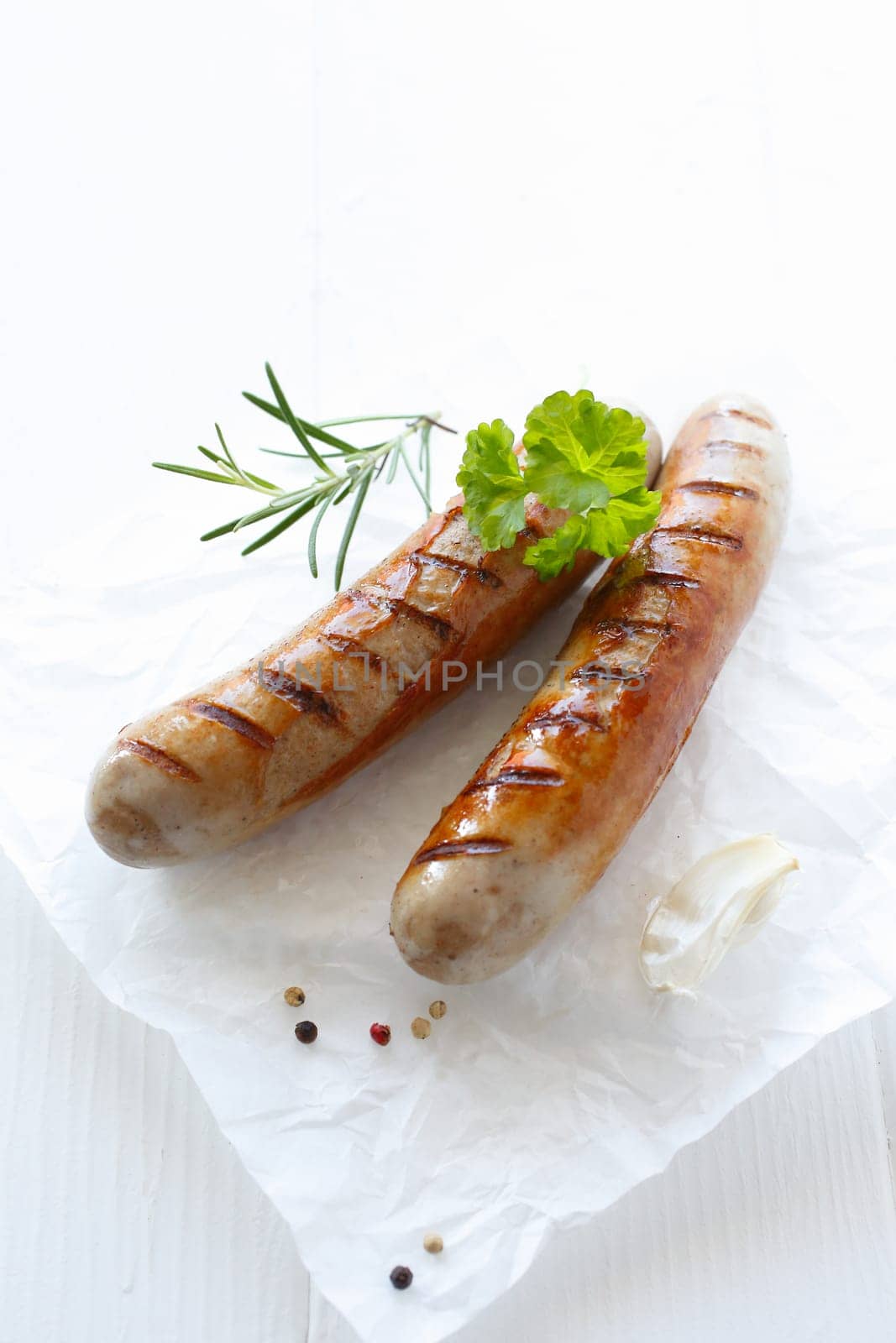 Close up grilled sausage over the white background
