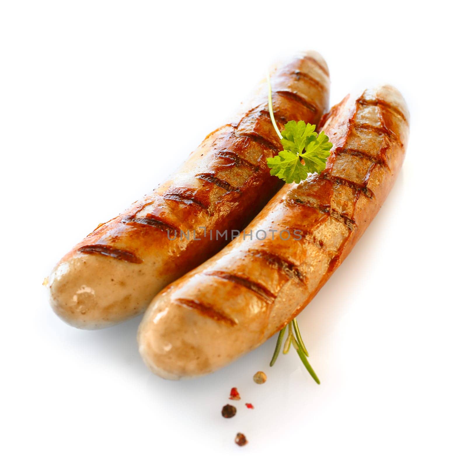 Two smoked sausage against the white background