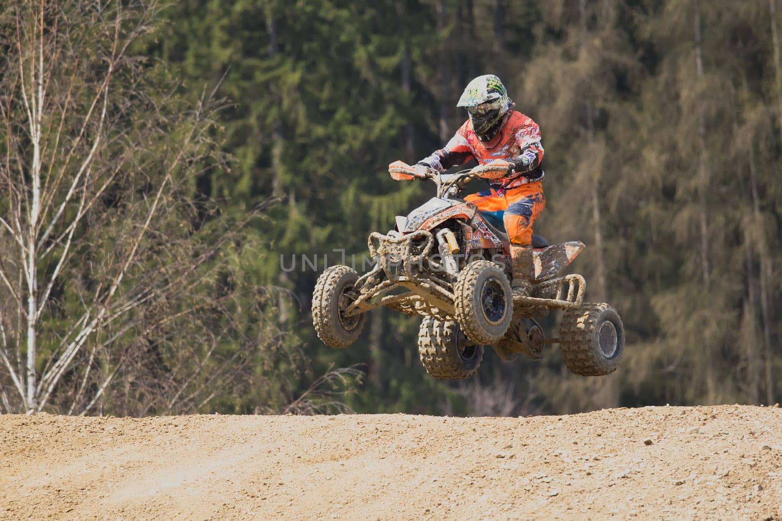 MOHELNICE,  CZECH REPUBLIC - APR 2013: Quad racer in jump on quad motorbike in the "Crossracing Cup 2013""  in April 21, 2013, MOHELNICE, Czech Republic."