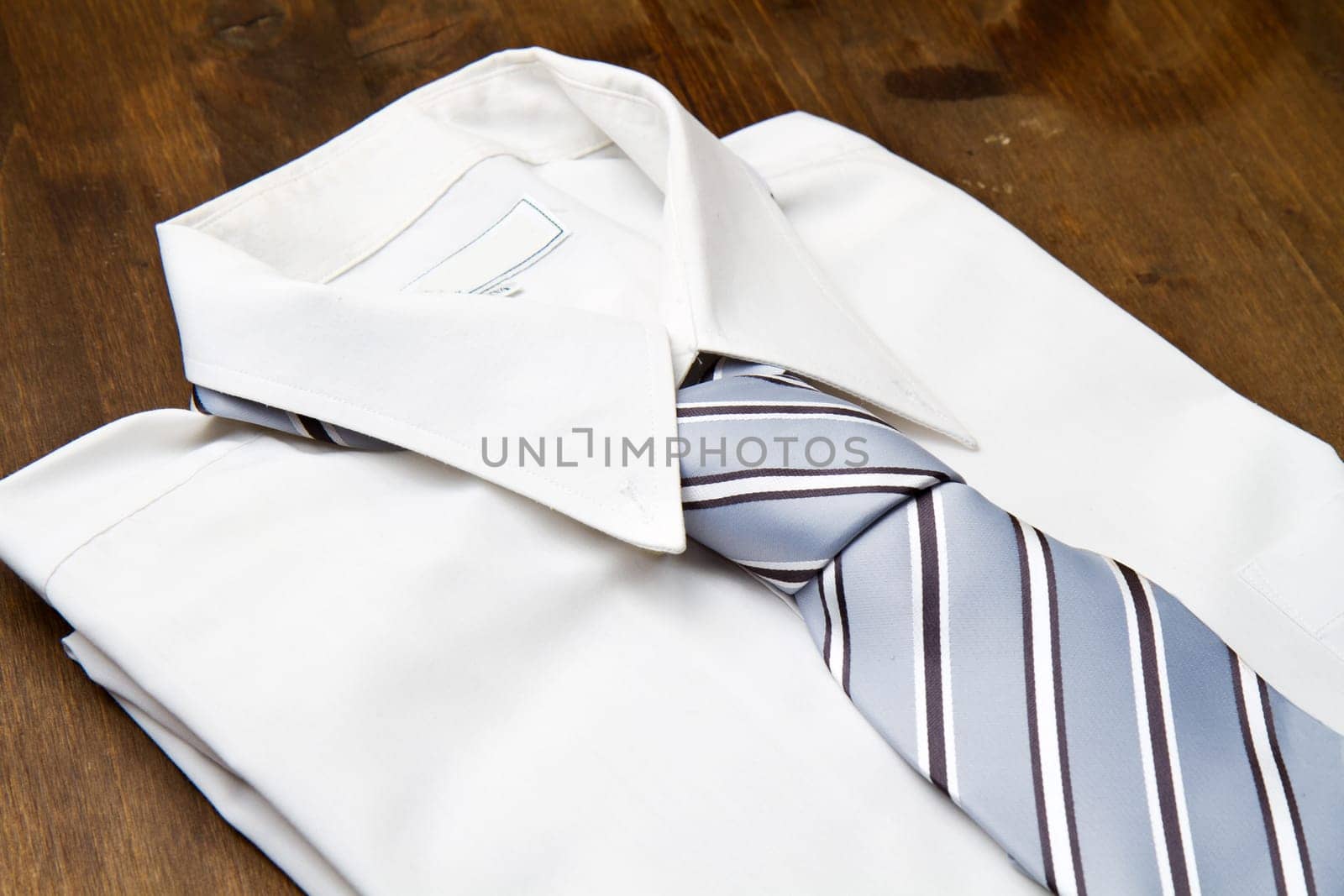 New white man's shirt and tie isolated on wood