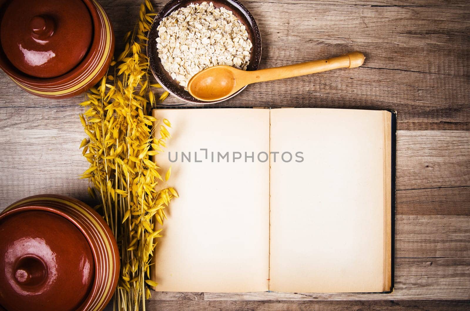 Oatmeal and an old recipe book on the kitchen table