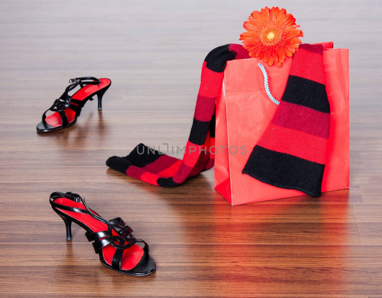 photo of the fashion still life with shoes and packet with flower