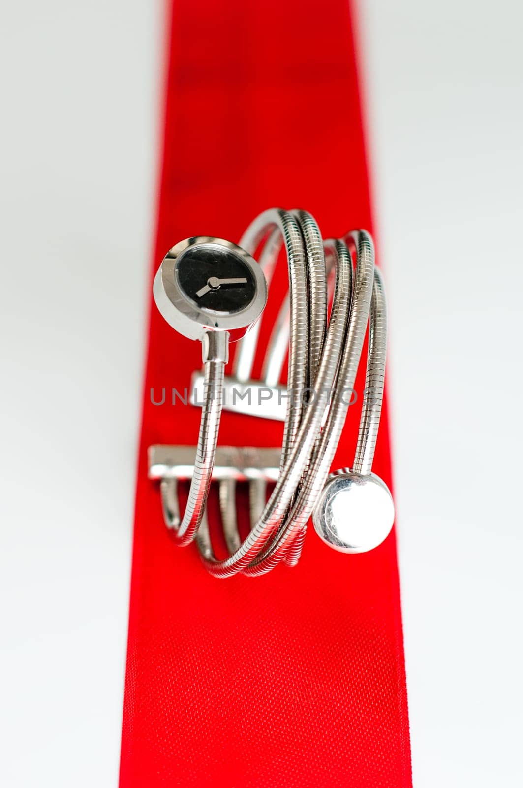 close up photo of femail fashion watches on a red stripe