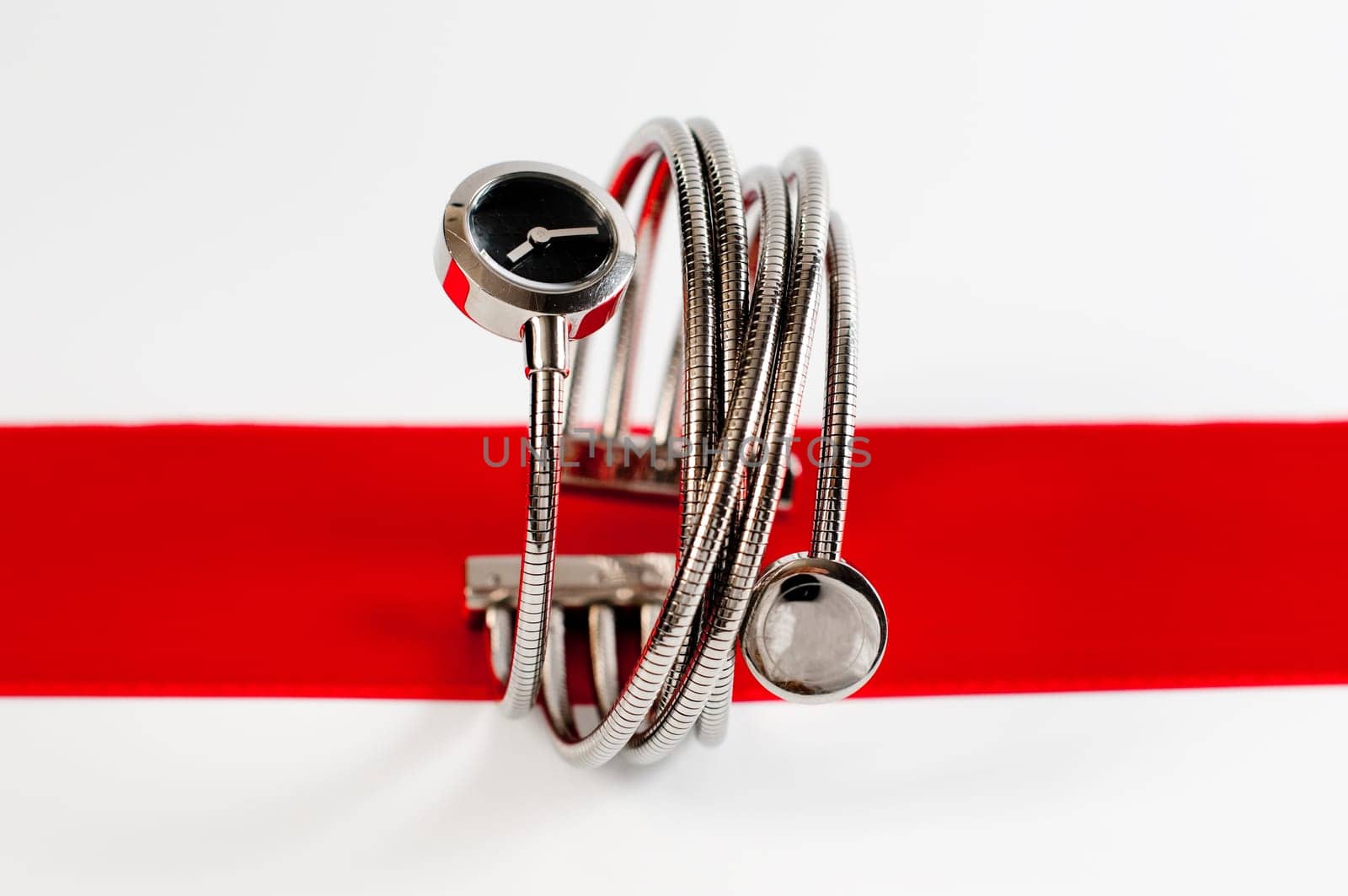 close up photo of femail fashion watches on a red stripe