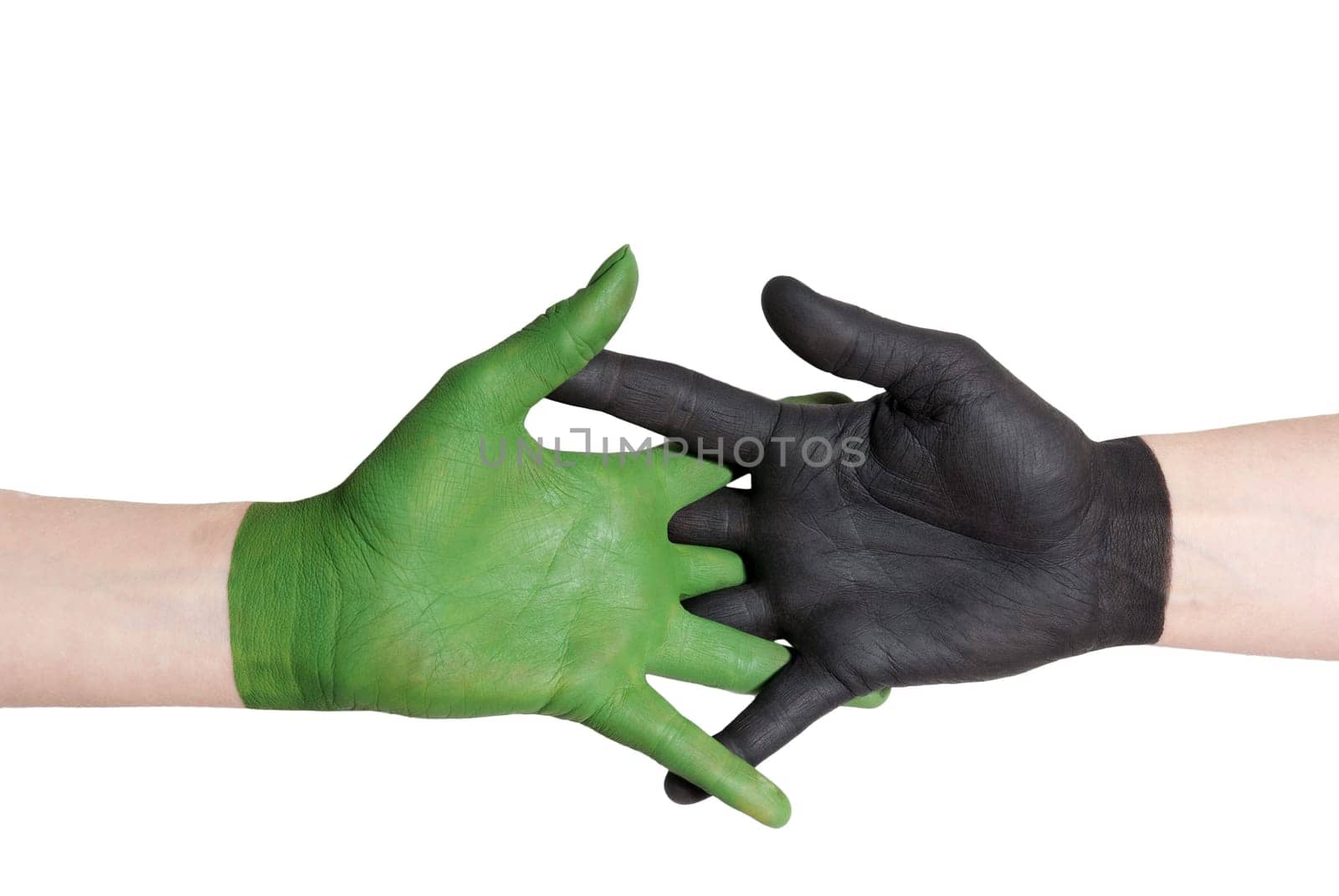 a handshake between a green and a black painted hand, isolated