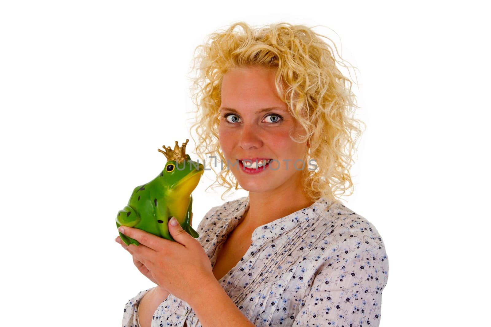Young woman with frog prince isolated on white background