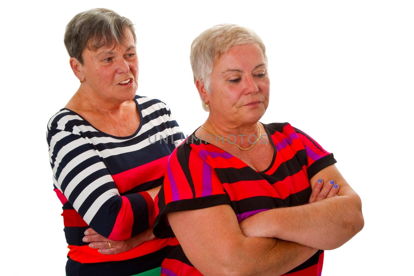 Two arguing senior women isolated on white background