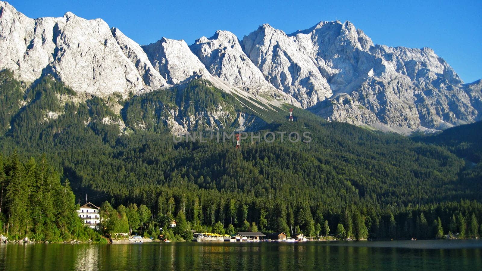 view to the top of germany, the Zugspitze, from lake Eibsee.