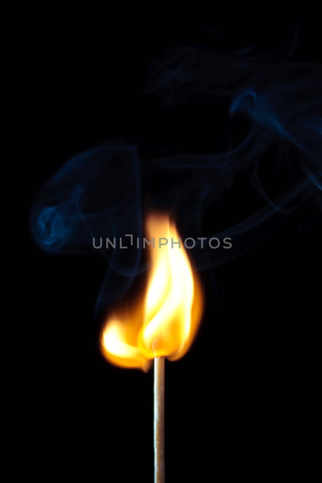 match burning with fire and smoke isolated on black background