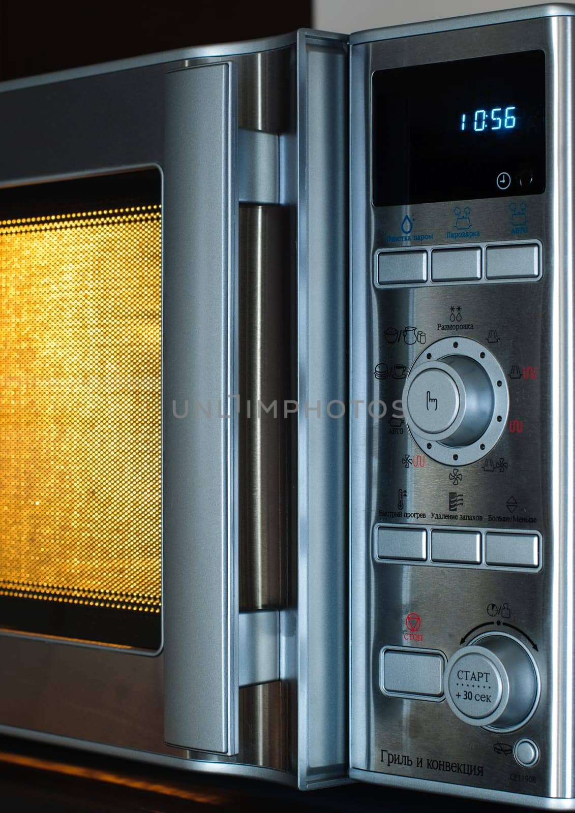 details of modern microwave oven in the kitchen