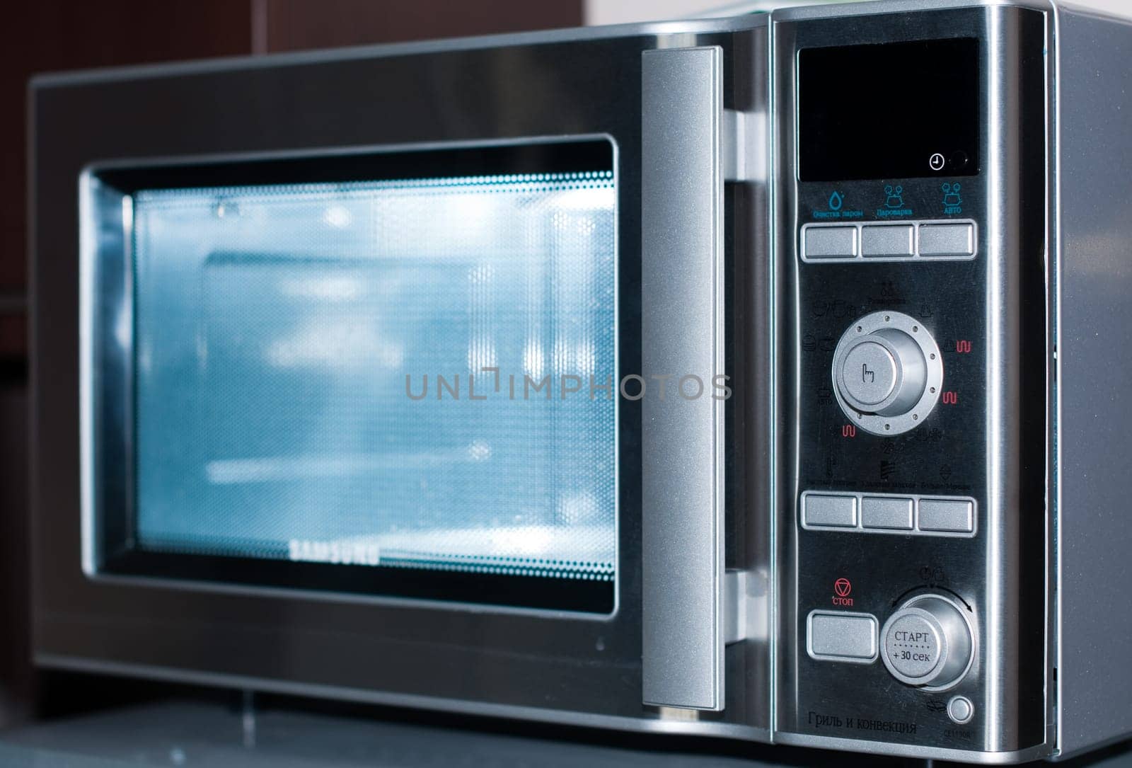details of modern microwave oven in the kitchen