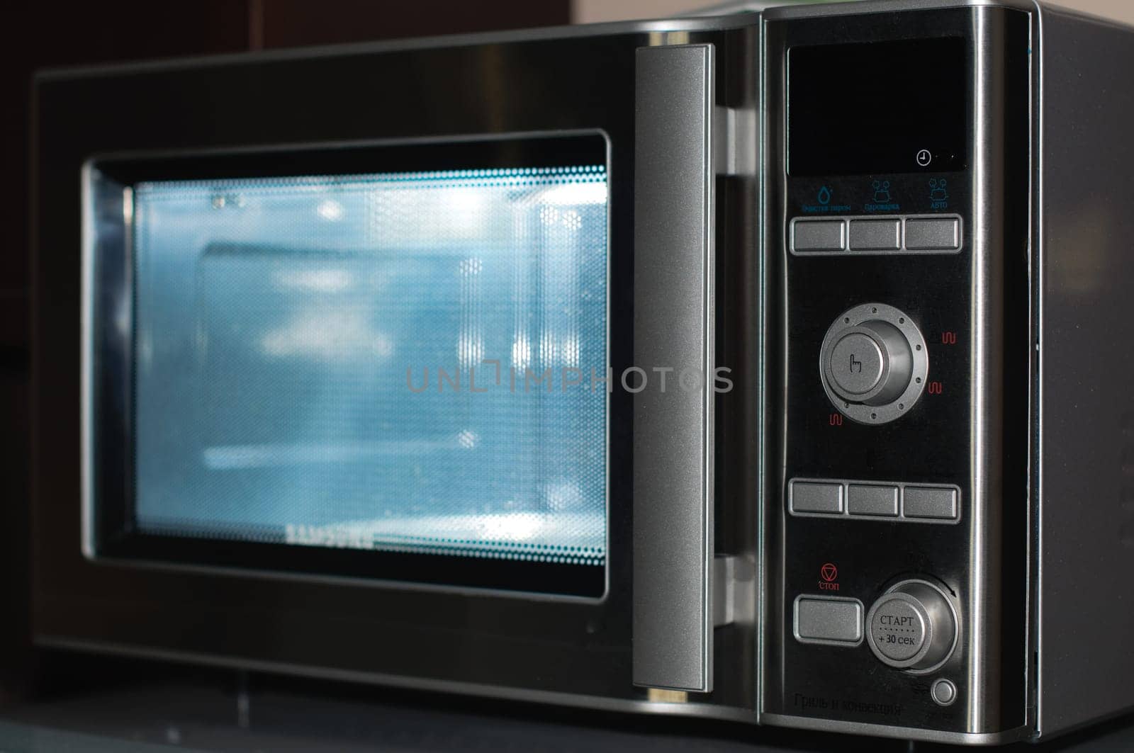 details of modern microwave oven in the kitchen