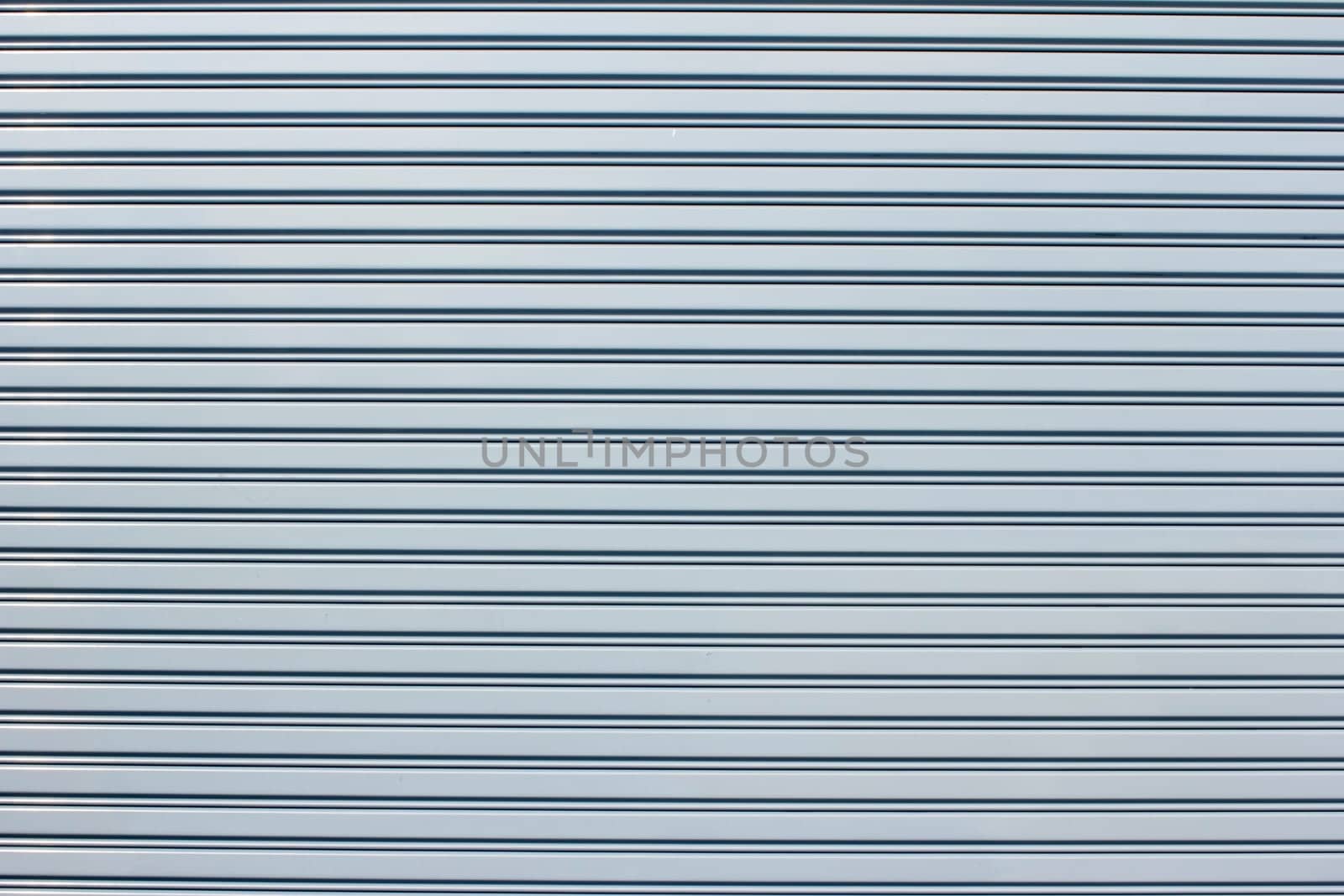 The metal has a straight line for the background.