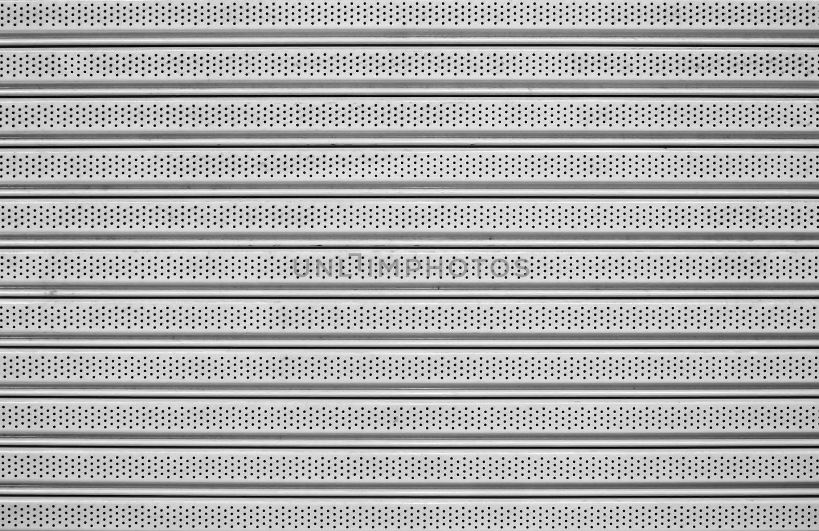 The metal has a straight line for the background.
