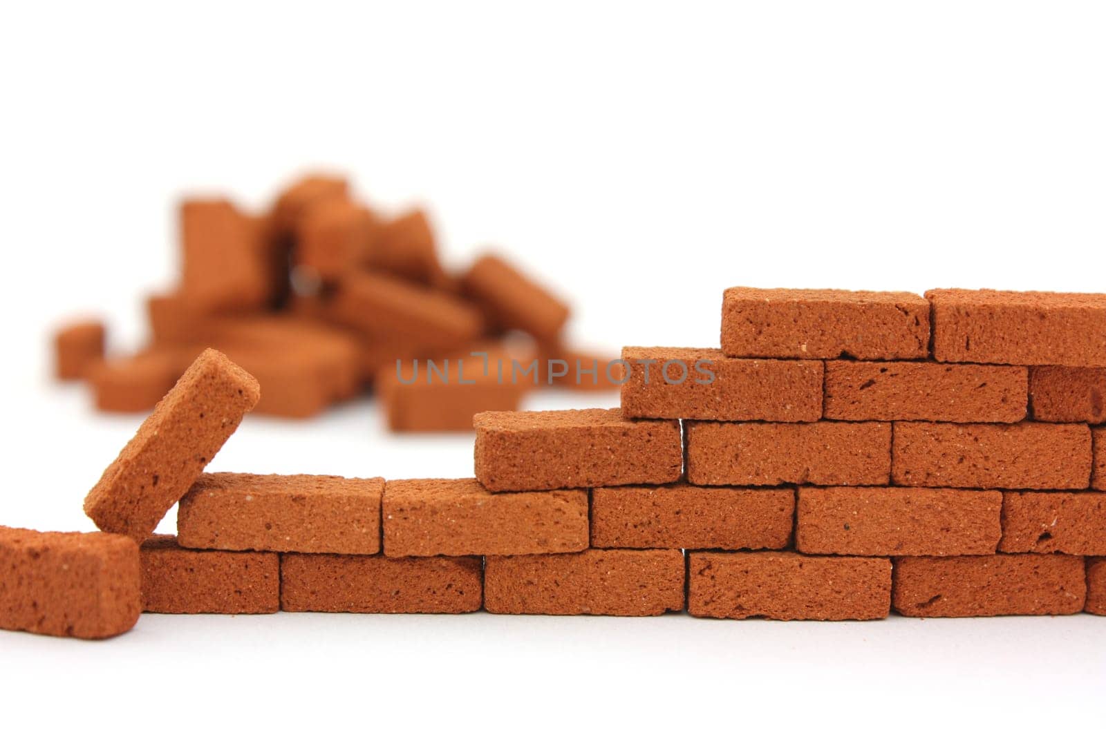 Building a brick wall with a white background