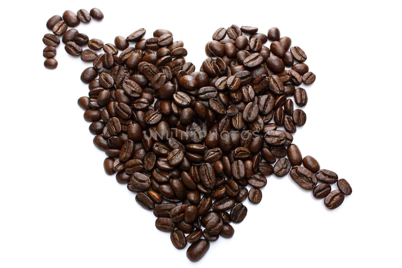Heart made of coffee beans on a white background