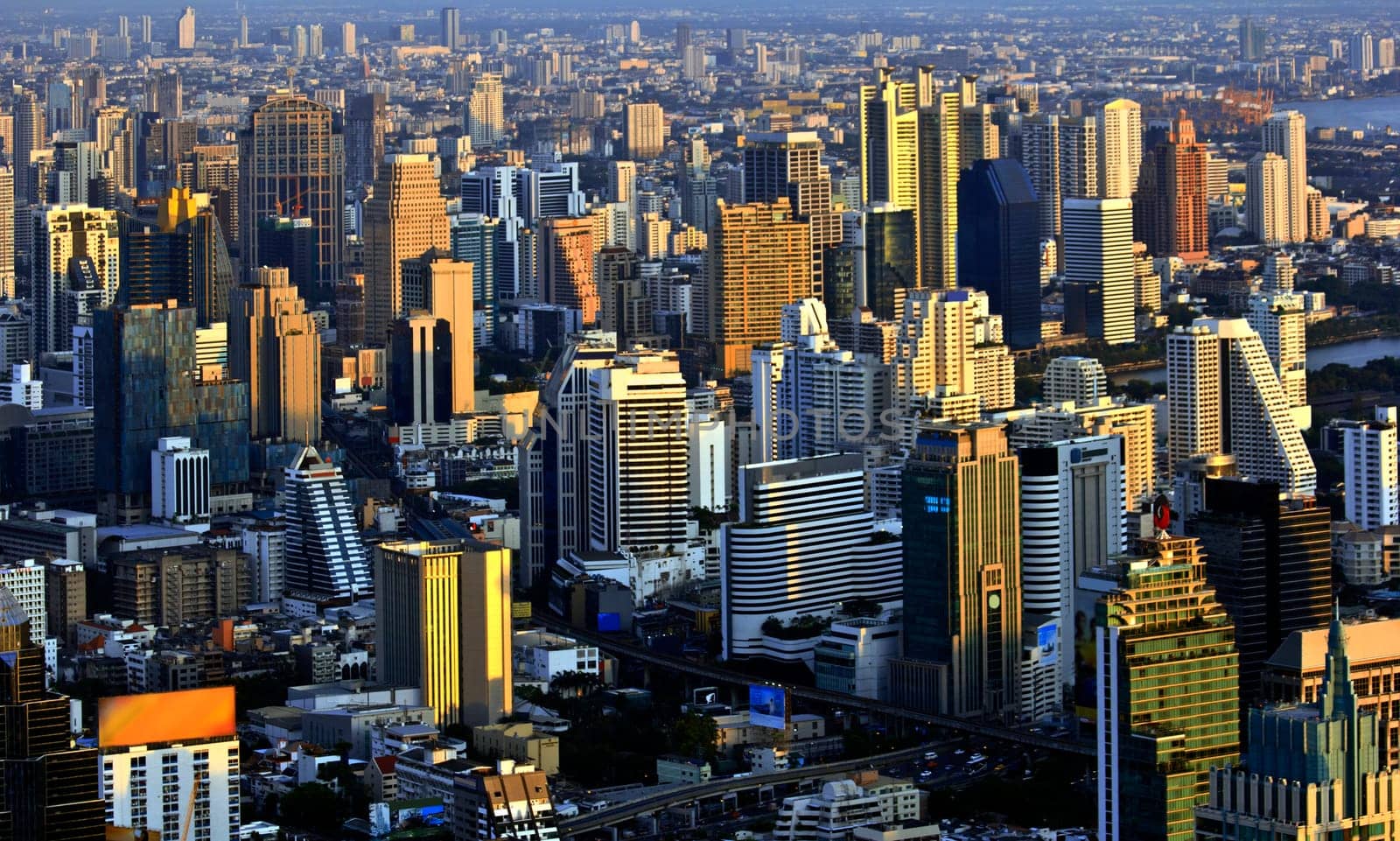 Modern skyscraper city streets in the evening,Bangkok,Thailand