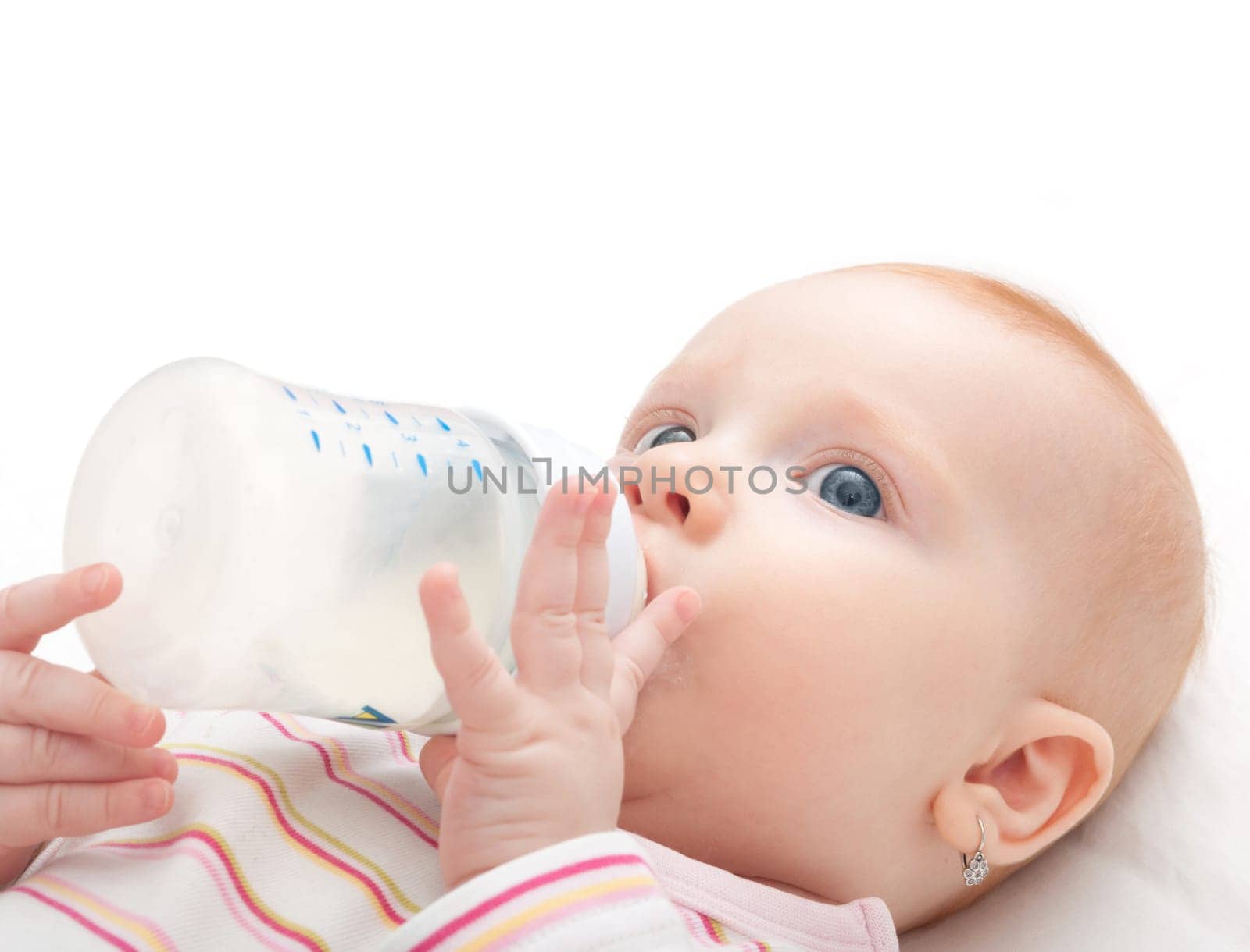 Baby Girl Drinking Milk from Bottle on White Background