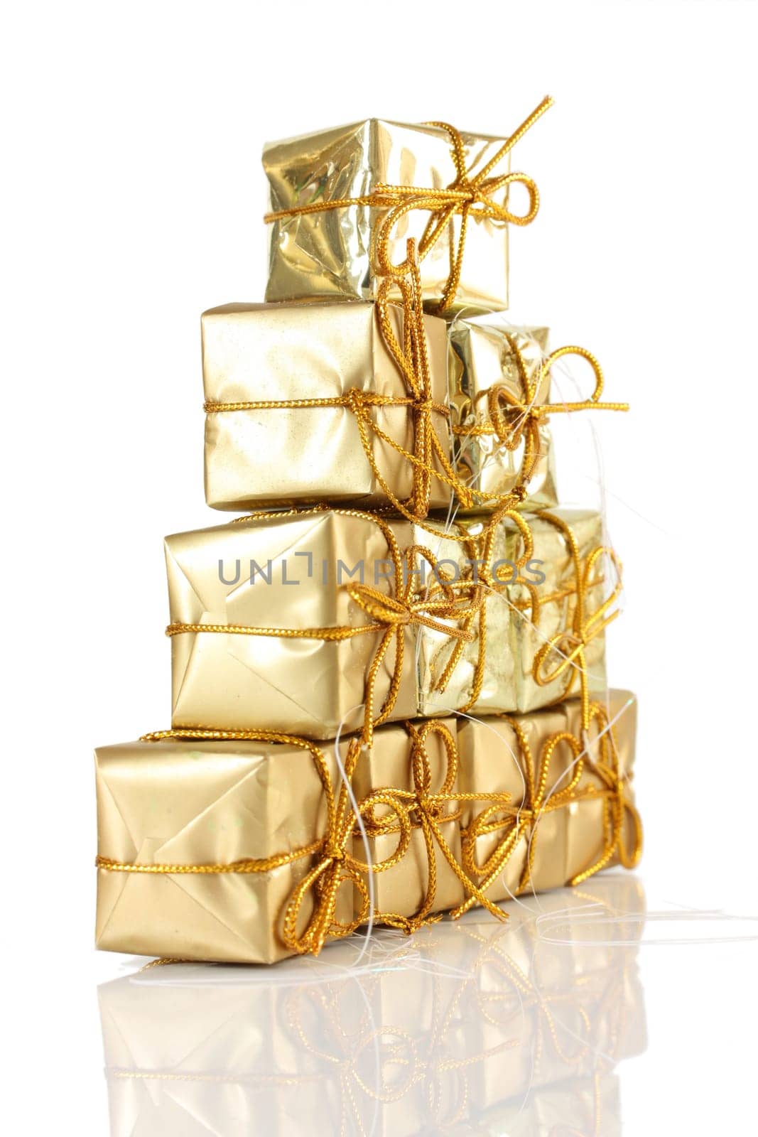 Gold gift wrapped parcels in a pyramid