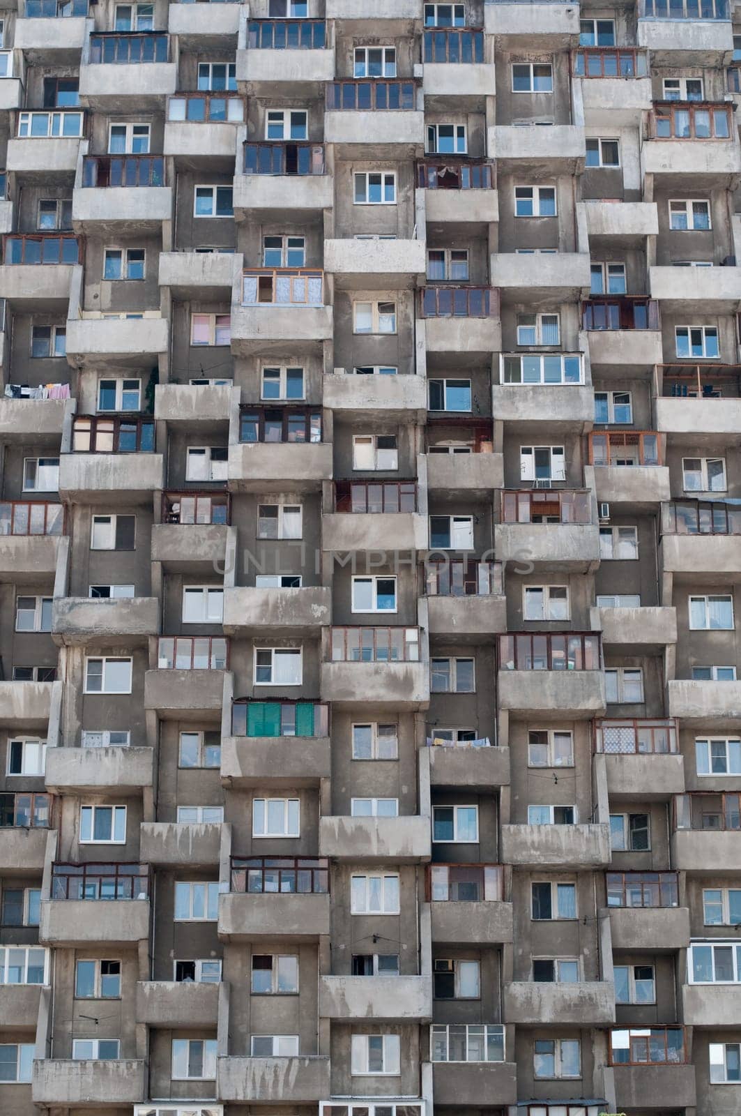 ugly hive like resident block building with lots of windows and balconies
