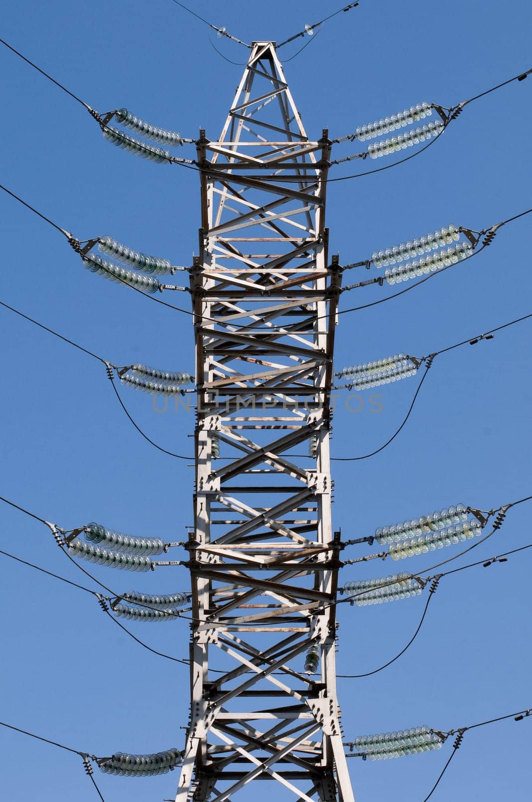 details of power line with blue sky at background