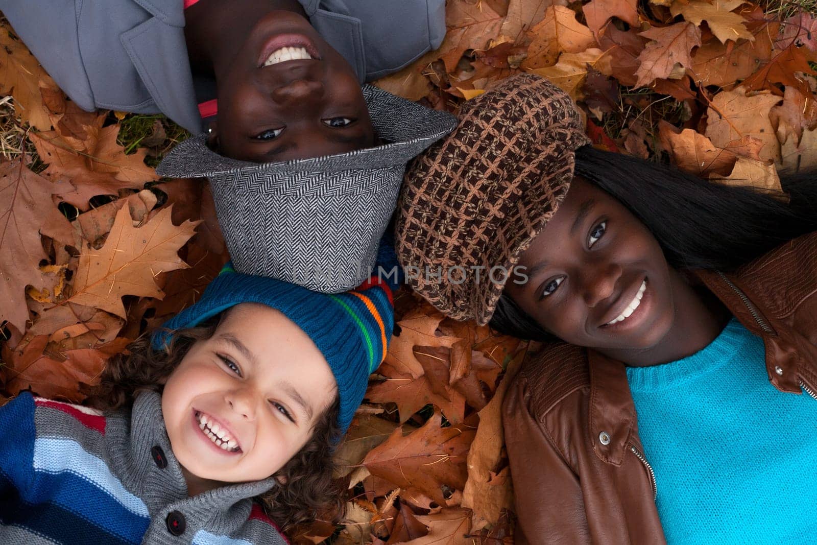 Happy family with foster children in the forest