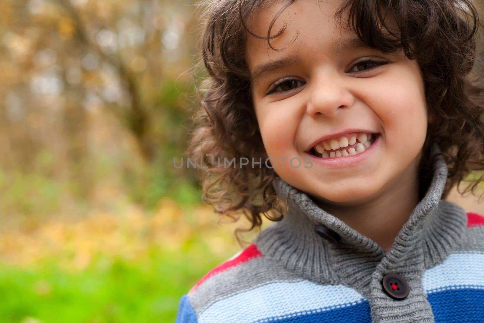 Happy child in the forest is having fun